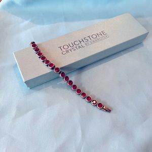 NIB Touchstone Crystal by Swarovski Retired Ice Bracelet with Red Crystals.